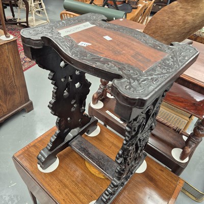 Lot 210 - An antique Chinese carved hardwood occasional...