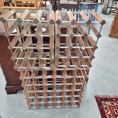 Lot 217 - Three wood and metal wine racks to hold a...