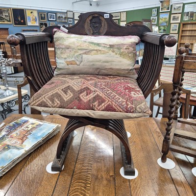 Lot 218 - An antique mahogany Savonarola chair H 92 W 76...