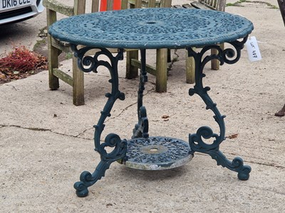 Lot 487 - A green garden table with floral design H 72 Ø...