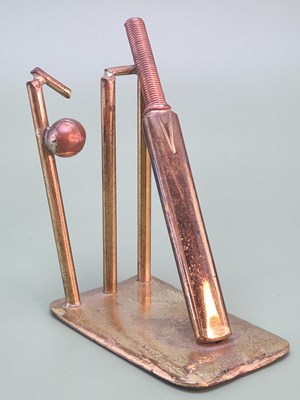 Lot 1765 - A small desktop brass paperweight in the form...