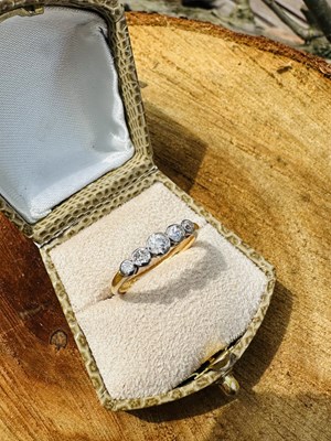 Lot 1020 - A diamond five-stone ring, set with five...