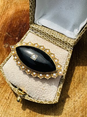 Lot 1030 - A Victorian onyx and seed pearl mourning...