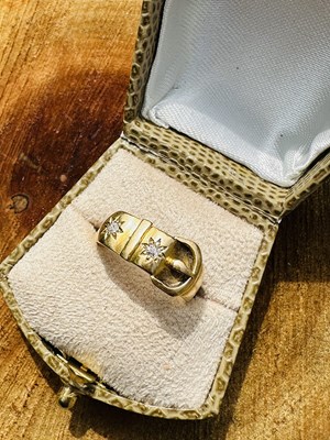 Lot 1041 - A Victorian diamond buckle ring, the...