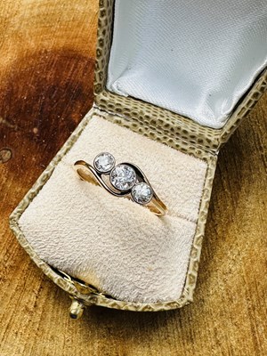 Lot 1059 - An antique old-cut diamond trilogy ring, set...