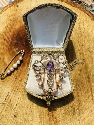 Lot 1073 - An Edwardian amethyst and seed pearl pendant...