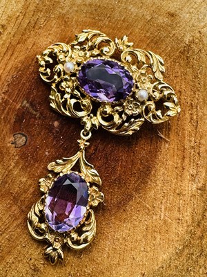 Lot 1075 - A vintage gold, amethyst and pearl brooch, the...