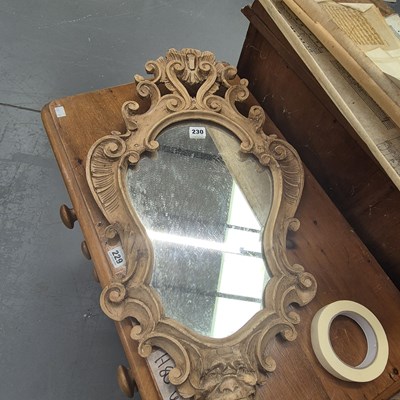 Lot 230 - An ornately carved antique mirror 69 × 40cm