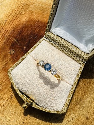 Lot 1092 - An Edwardian sapphire and diamond three stone...