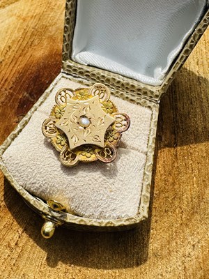 Lot 1117 - A Victorian seed pearl set brooch, the floral...