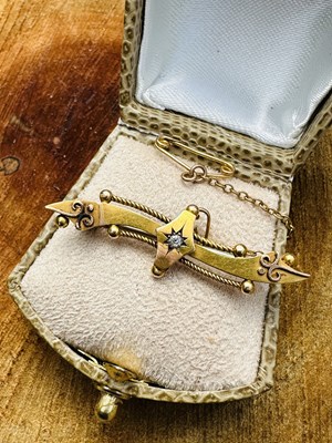 Lot 1131 - A Edwardian diamond set scimitar brooch, the...