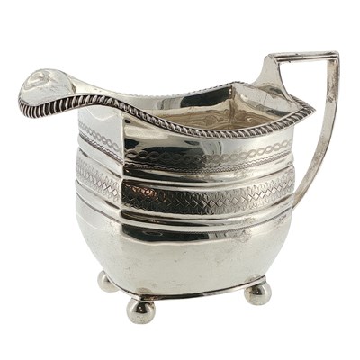 Lot 1155 - A Georgian hallmarked silver cream jug, London...