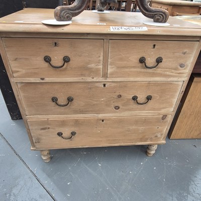 Lot 237 - A Victorian pine chest of two over two drawers...