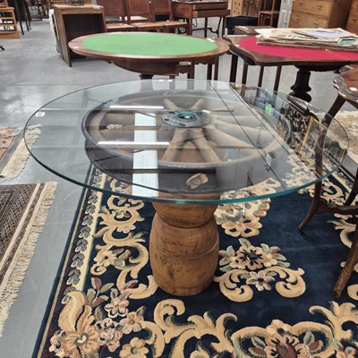Lot 363 - A glass, wood and wagon wheel occasional table...