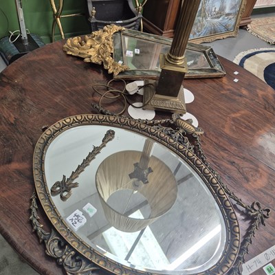 Lot 366 - An oval Regency style wall mirror and a...