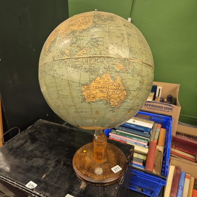 Lot 371 - A vintage terrestrial globe on a wood and...
