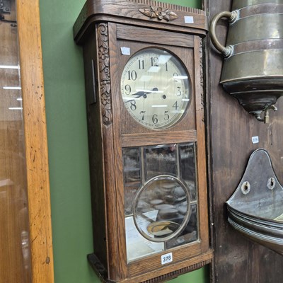 Lot 378 - An early 20th century oak cased 'ting tang'...
