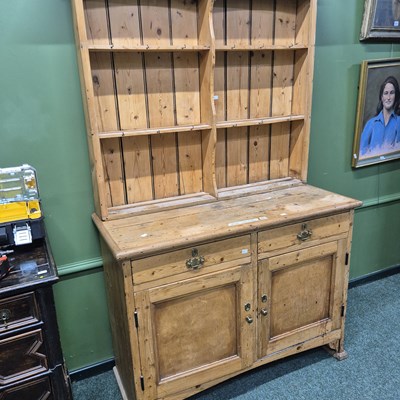 Lot 405 - A 19th century and later pine dresser, the...