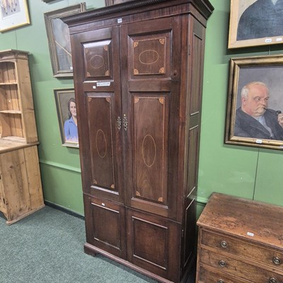 Lot 410 - A 19th century mahogany wardrobe, the hanging...