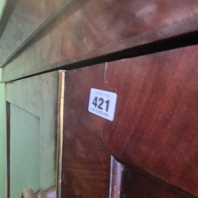 Lot 421 - A Victorian mahogany linen press, the twin...