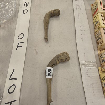 Lot 800 - Two horn pipes, the bowls modelled as female...