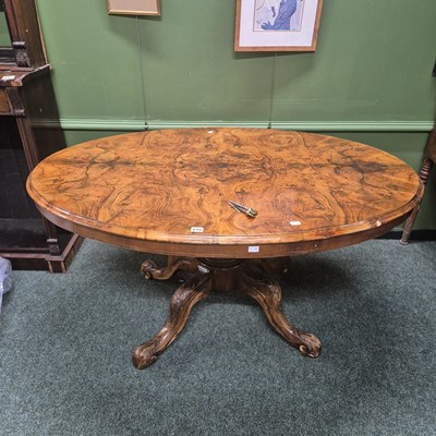Lot 272 - An antique walnut tilt top centre table on a...