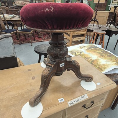 Lot 241 - A 19th century carved mahogany piano stool,...