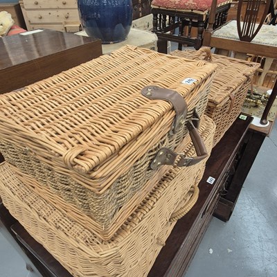 Lot 242 - Three wicker hampers, one fitted with four...