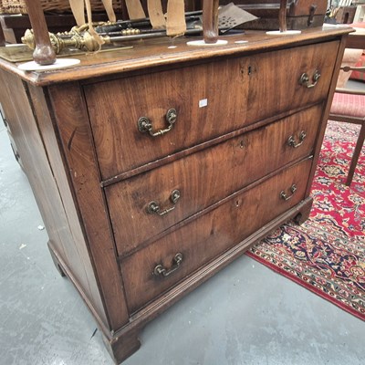 Lot 245 - A Georgian mahogany chest of three drawers on...