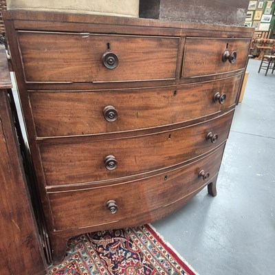 Lot 247 - A Georgian mahogany bow front chest of two...