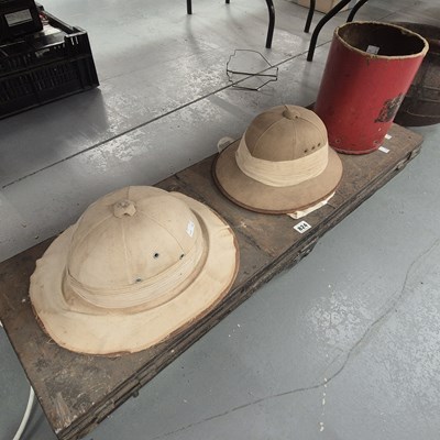 Lot 824 - Two solar topees, a metal gun case, a shell...
