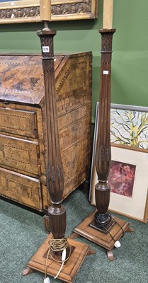Lot 1579 - A pair of antique mahogany standard lamps on...