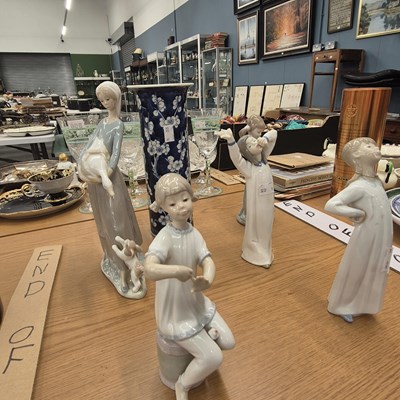 Lot 843 - Five figures by Lladro and Nao, together with...