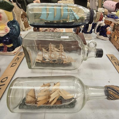 Lot 848 - Three various ships in bottles
