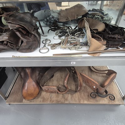 Lot 861 - Leather saddle bags, saddles, stirrups, horse...