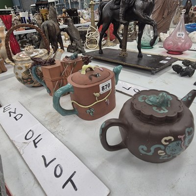 Lot 870 - Three Yixing tea pots, together with another...