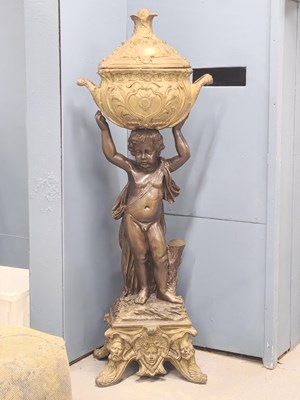 Lot 1573 - An early 20th century bronze figure of a putto...