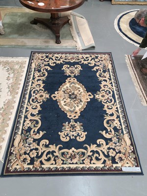 Lot 449 - A machine made rug of French design 203 × 169cm