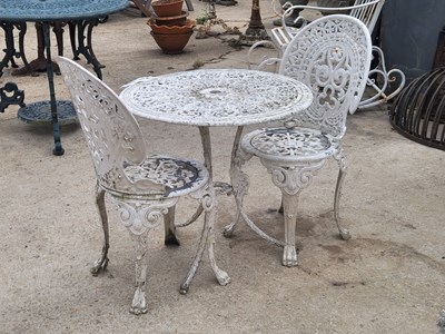 Lot 488 - A cast alloy garden table of floral design H...