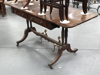 Lot 179A - An antique rosewood sofa table on a pair of...
