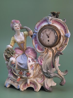Lot 1807 - A Vienna porcelain clock group with a flower...