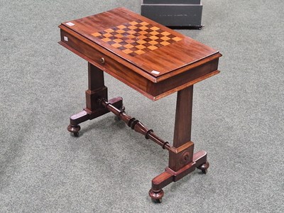Lot 939 - An antique lift top chess table with an inlaid...