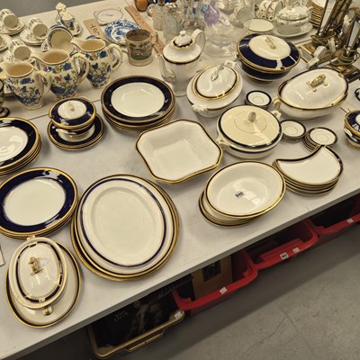 Lot 940 - A Royal Worcester dinner service with blue and...