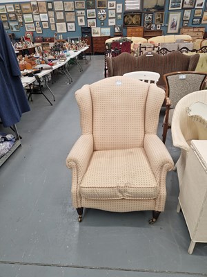 Lot 61A - A vintage wing back arm chair in a pale and...