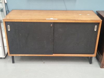 Lot 3 - A mid century teak and painted sideboard on...