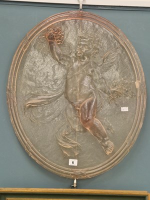 Lot 6 - A cast resin pink oval panel of a cherub 67 ×...