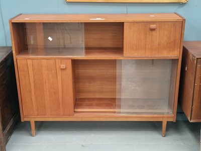 Lot 10 - A mid century teak and glass sideboard by...
