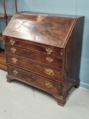 Lot 31 - A 19th century flame mahogany bureau, the...