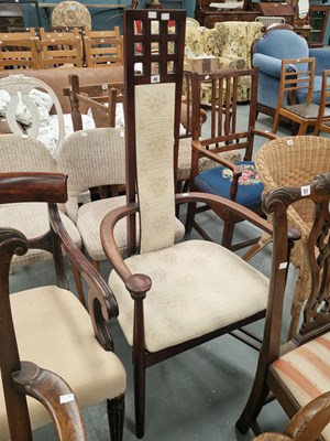Lot 48 - A mahogany high back armchair in the manner of...
