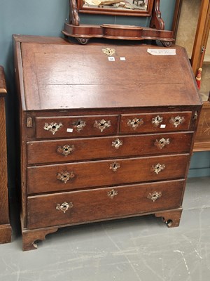 Lot 64 - A 19th century oak bureau of two over three...